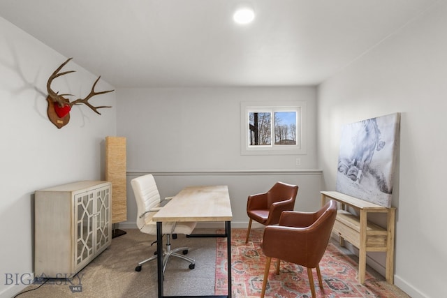 office space featuring carpet floors and baseboards