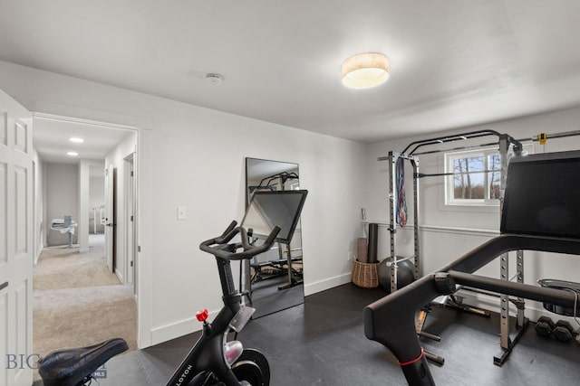 workout area featuring baseboards