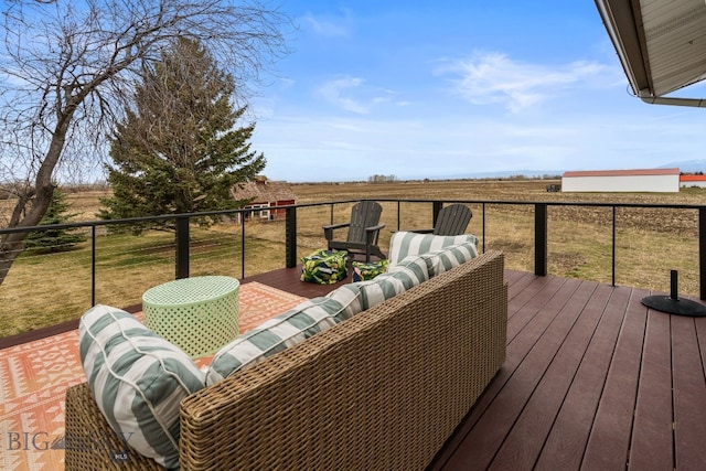wooden terrace featuring a rural view