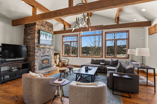 2430 Two Gun White Calf Rd, Big Sky, MT 59716 - living area featuring plenty of natural light, wood finished floors, a stone fireplace, and recessed lighting