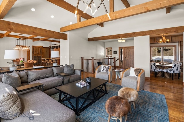 2430 Two Gun White Calf Rd, Big Sky, MT 59716 - living area with a chandelier, beam ceiling, wood finished floors, recessed lighting, and high vaulted ceiling