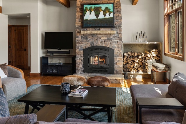 2430 Two Gun White Calf Rd, Big Sky, MT 59716 - living room featuring wood finished floors and a stone fireplace