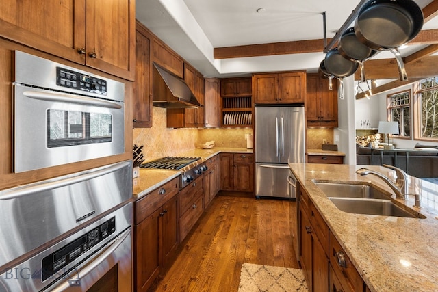 2430 Two Gun White Calf Rd, Big Sky, MT 59716 - kitchen featuring appliances with stainless steel finishes, range hood, a sink, dark wood-style flooring, and backsplash