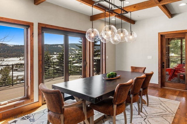 2430 Two Gun White Calf Rd, Big Sky, MT 59716 - dining area featuring beamed ceiling, plenty of natural light, hardwood / wood-style floors, recessed lighting, and coffered ceiling