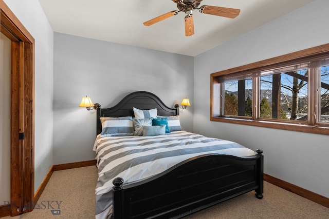 2430 Two Gun White Calf Rd, Big Sky, MT 59716 - bedroom with carpet flooring, baseboards, and ceiling fan