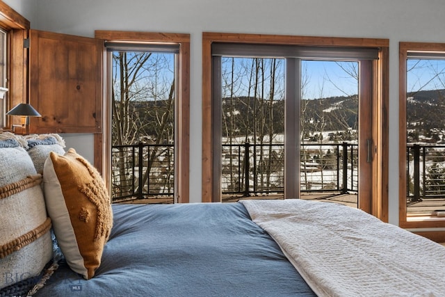 2430 Two Gun White Calf Rd, Big Sky, MT 59716 - bedroom with access to outside and a mountain view
