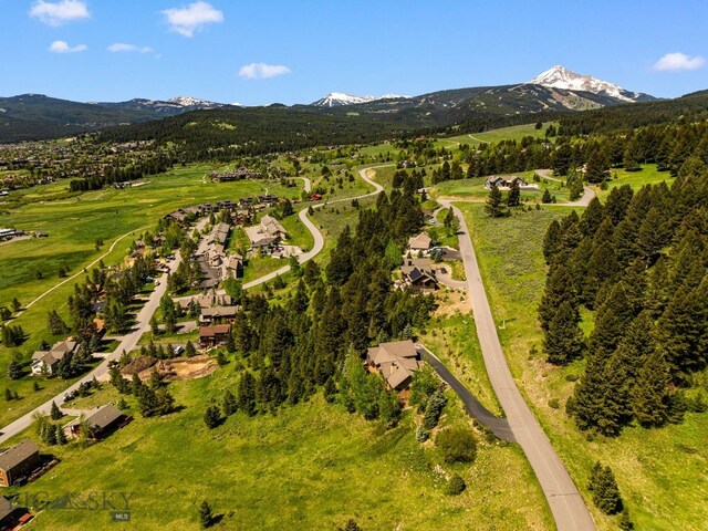 2430 Two Gun White Calf Rd, Big Sky, MT 59716 - aerial perspective of suburban area featuring a mountain backdrop