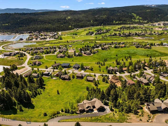 2430 Two Gun White Calf Rd, Big Sky, MT 59716 - aerial perspective of suburban area with a water and mountain view