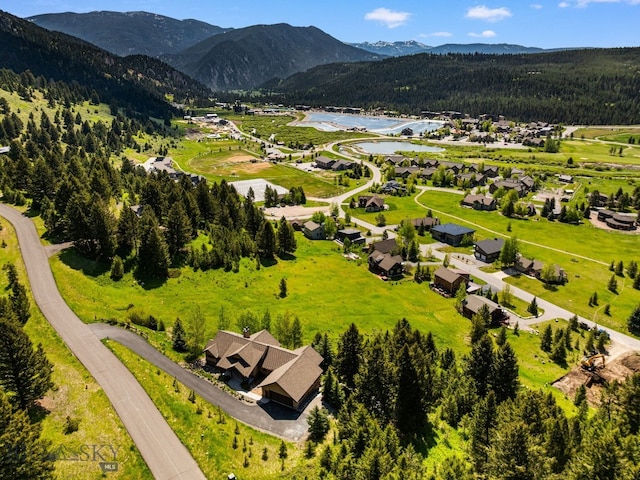 2430 Two Gun White Calf Rd, Big Sky, MT 59716 - aerial view of residential area featuring a water and mountain view