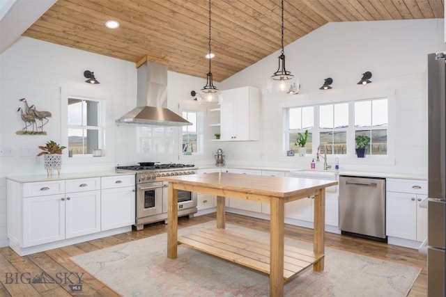 992 Deer Haven Dr, Deer Lodge, MT 59722 - kitchen featuring appliances with stainless steel finishes, wall chimney exhaust hood, wood ceiling, a sink, and vaulted ceiling