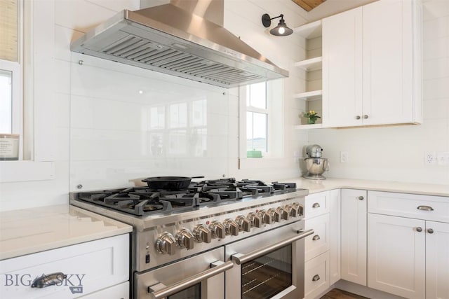 992 Deer Haven Dr, Deer Lodge, MT 59722 - kitchen with exhaust hood, double oven range, open shelves, white cabinetry, and light countertops