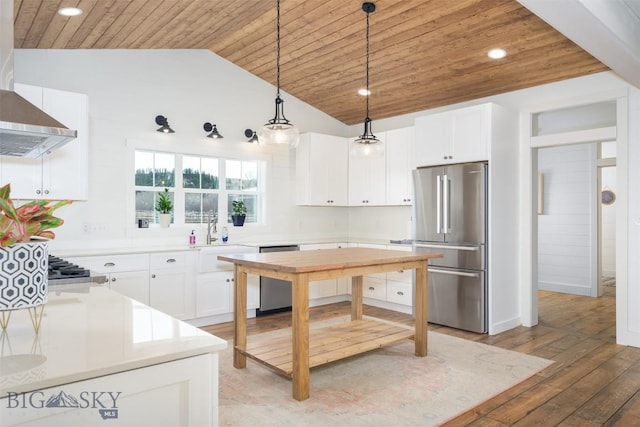 992 Deer Haven Dr, Deer Lodge, MT 59722 - kitchen with appliances with stainless steel finishes, wood ceiling, a sink, decorative light fixtures, and light countertops