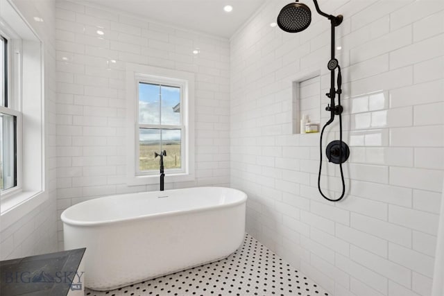 992 Deer Haven Dr, Deer Lodge, MT 59722 - bathroom with a freestanding tub, tiled shower, and tile walls