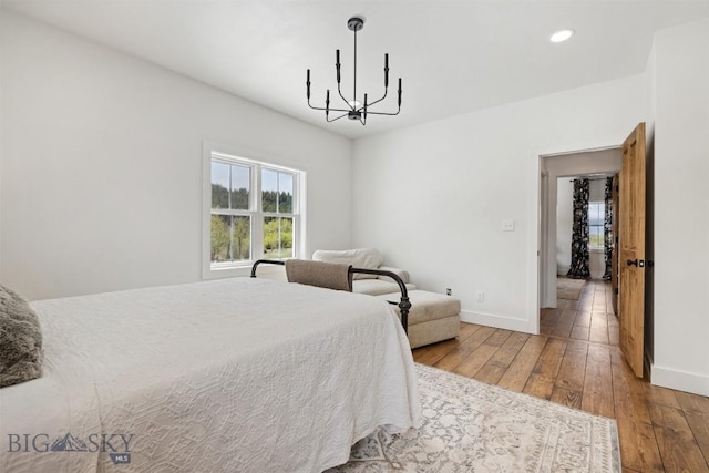 992 Deer Haven Dr, Deer Lodge, MT 59722 - bedroom featuring hardwood / wood-style floors, baseboards, a chandelier, and recessed lighting