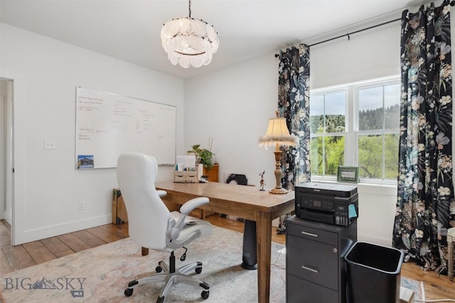 992 Deer Haven Dr, Deer Lodge, MT 59722 - office space with wood-type flooring, a chandelier, and baseboards