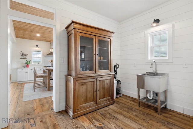 992 Deer Haven Dr, Deer Lodge, MT 59722 - bar area with light wood-type flooring and wooden walls
