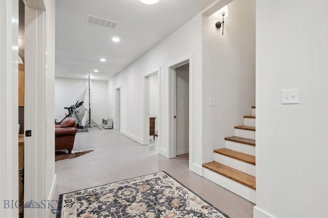 992 Deer Haven Dr, Deer Lodge, MT 59722 - corridor featuring concrete flooring, stairway, baseboards, and recessed lighting
