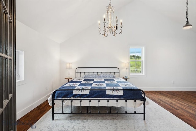 992 Deer Haven Dr, Deer Lodge, MT 59722 - bedroom featuring high vaulted ceiling, a chandelier, baseboards, and wood finished floors