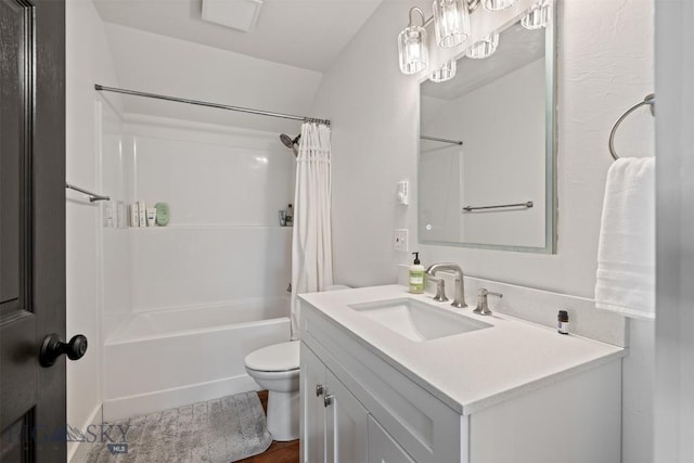 992 Deer Haven Dr, Deer Lodge, MT 59722 - full bathroom featuring vanity, toilet, shower / bath combo with shower curtain, and wood finished floors