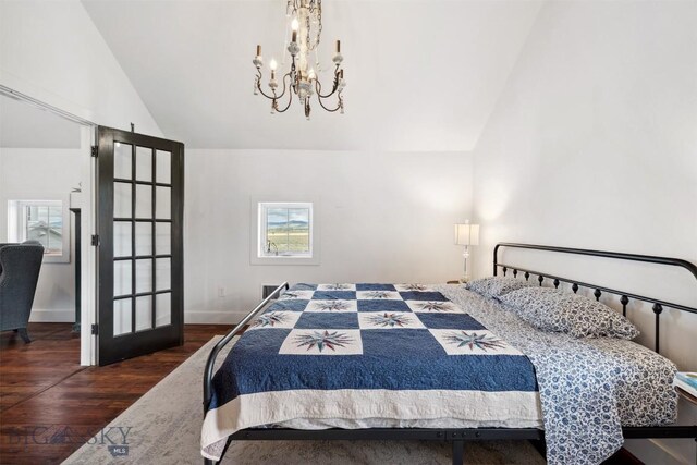 992 Deer Haven Dr, Deer Lodge, MT 59722 - bedroom with wood finished floors, a chandelier, high vaulted ceiling, and french doors