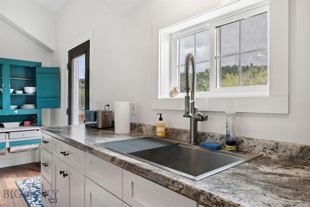 992 Deer Haven Dr, Deer Lodge, MT 59722 - kitchen with a sink, white cabinetry, and wood finished floors