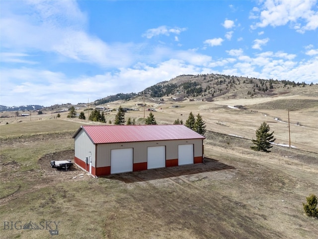 14 Sunflower Ln, Livingston, MT 59047 - view of outbuilding featuring a rural view, a mountain view, and an outbuilding