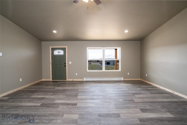 foyer entrance with recessed lighting, wood finished floors, a ceiling fan, a baseboard heating unit, and baseboards
