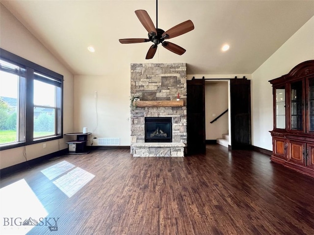 unfurnished living room featuring visible vents, ceiling fan, wood finished floors, and lofted ceiling