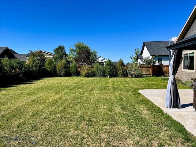 view of yard with a patio area and fence