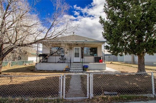 1916 S Jackson, Butte, MT 59701 - view of front of home with a porch, a gate, and a fenced front yard