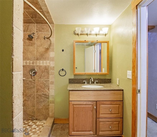 1916 S Jackson, Butte, MT 59701 - bathroom featuring baseboards, tiled shower, and vanity