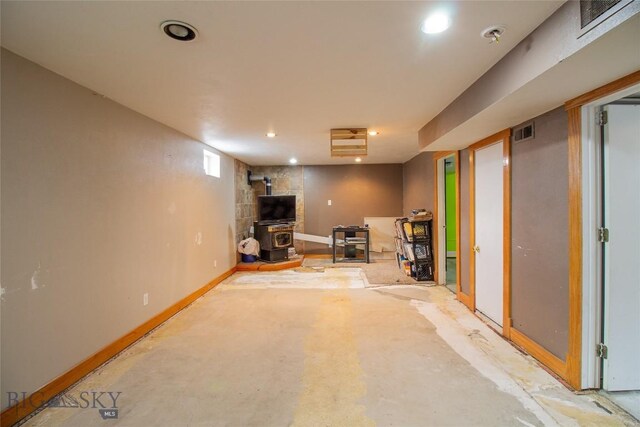 1916 S Jackson, Butte, MT 59701 - below grade area with visible vents, a wood stove, recessed lighting, and baseboards