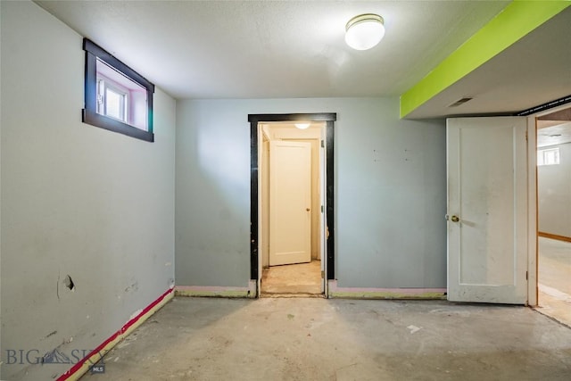 1916 S Jackson, Butte, MT 59701 - interior space featuring baseboards, unfinished concrete flooring, and visible vents