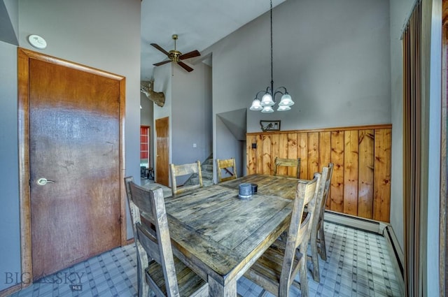 5585 W Cameron Bridge Rd, Manhattan, MT 59741 - dining room with a chandelier, ceiling fan, tile patterned floors, a baseboard radiator, and baseboard heating