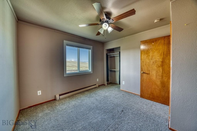 5585 W Cameron Bridge Rd, Manhattan, MT 59741 - unfurnished bedroom with a baseboard radiator, carpet, ornamental molding, a textured ceiling, and a closet
