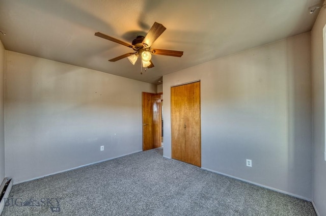 5585 W Cameron Bridge Rd, Manhattan, MT 59741 - empty room featuring carpet flooring, a ceiling fan, and a baseboard radiator