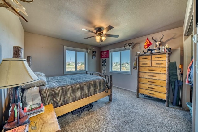 5585 W Cameron Bridge Rd, Manhattan, MT 59741 - carpeted bedroom featuring a textured ceiling and a ceiling fan