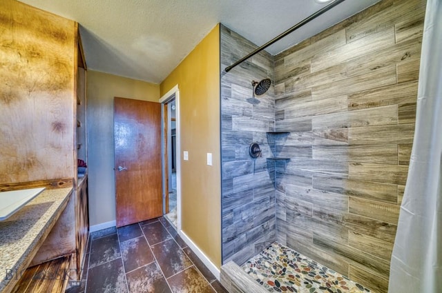 5585 W Cameron Bridge Rd, Manhattan, MT 59741 - bathroom with tiled shower and baseboards