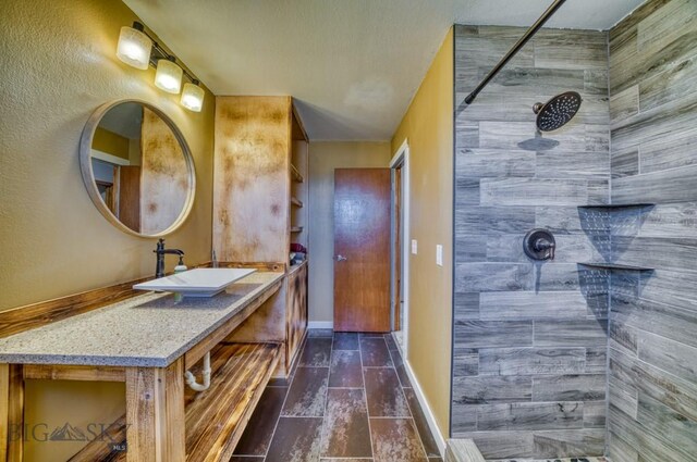 5585 W Cameron Bridge Rd, Manhattan, MT 59741 - bathroom with a tile shower and vanity