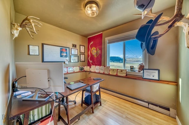 5585 W Cameron Bridge Rd, Manhattan, MT 59741 - office space featuring a baseboard radiator and wood finished floors