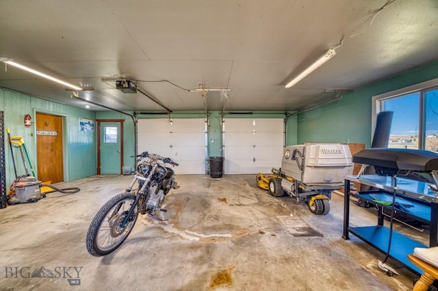 5585 W Cameron Bridge Rd, Manhattan, MT 59741 - garage featuring a garage door opener