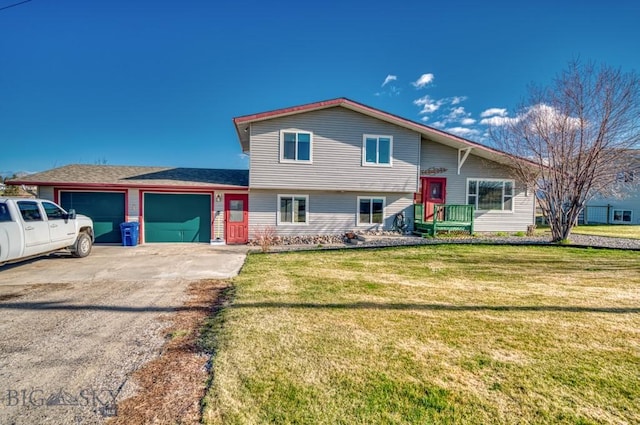 5585 W Cameron Bridge Rd, Manhattan, MT 59741 - tri-level home with an attached garage, a front yard, and driveway