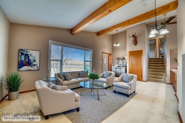 5585 W Cameron Bridge Rd, Manhattan, MT 59741 - carpeted living area with stairs, a chandelier, and beamed ceiling