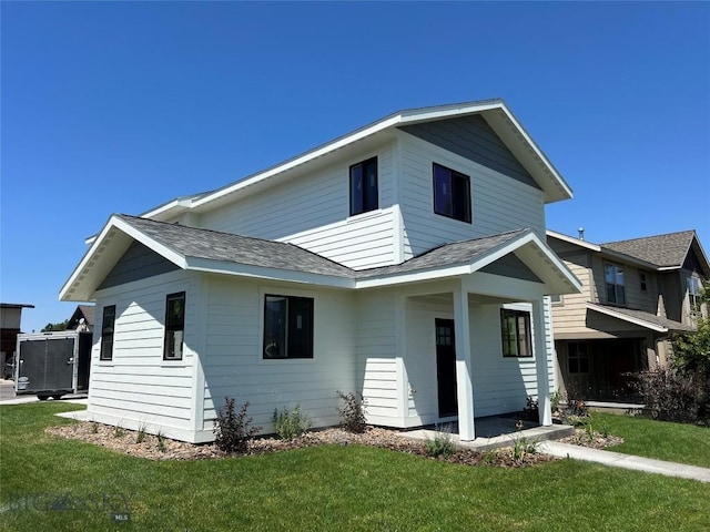 1033 N 14th, Bozeman, MT 59715 - rear view of property featuring a shingled roof and a lawn