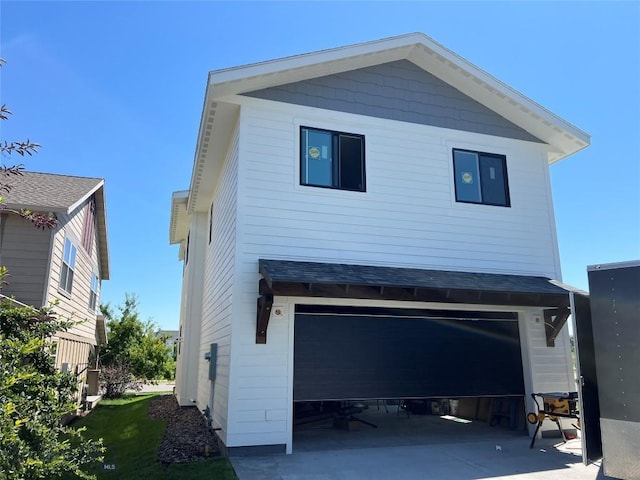 1033 N 14th, Bozeman, MT 59715 - rear view of house with an attached garage and concrete driveway
