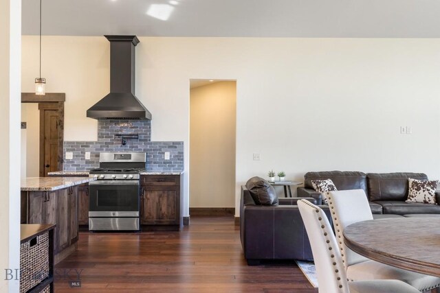 9 Cedar Ct, Ennis, MT 59751 - kitchen with gas range, wall chimney exhaust hood, dark wood-style floors, tasteful backsplash, and open floor plan