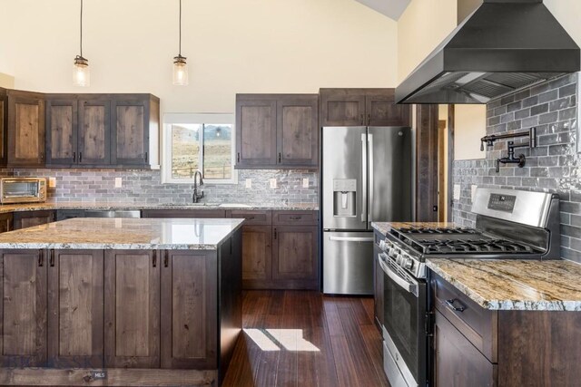 9 Cedar Ct, Ennis, MT 59751 - kitchen featuring custom exhaust hood, appliances with stainless steel finishes, backsplash, dark wood-style floors, and dark brown cabinetry