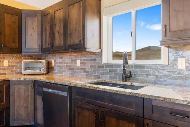 9 Cedar Ct, Ennis, MT 59751 - kitchen with dishwasher, backsplash, and light stone countertops
