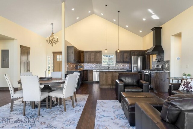 9 Cedar Ct, Ennis, MT 59751 - dining room with electric panel, high vaulted ceiling, a chandelier, dark wood finished floors, and recessed lighting