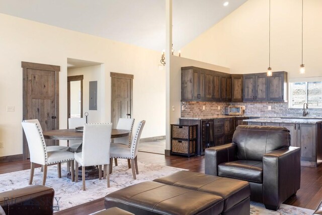 9 Cedar Ct, Ennis, MT 59751 - living area with dark wood-style flooring and electric panel